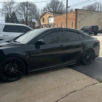 Black Car tinted at Proforamance Window Tint in Geneva Illinois